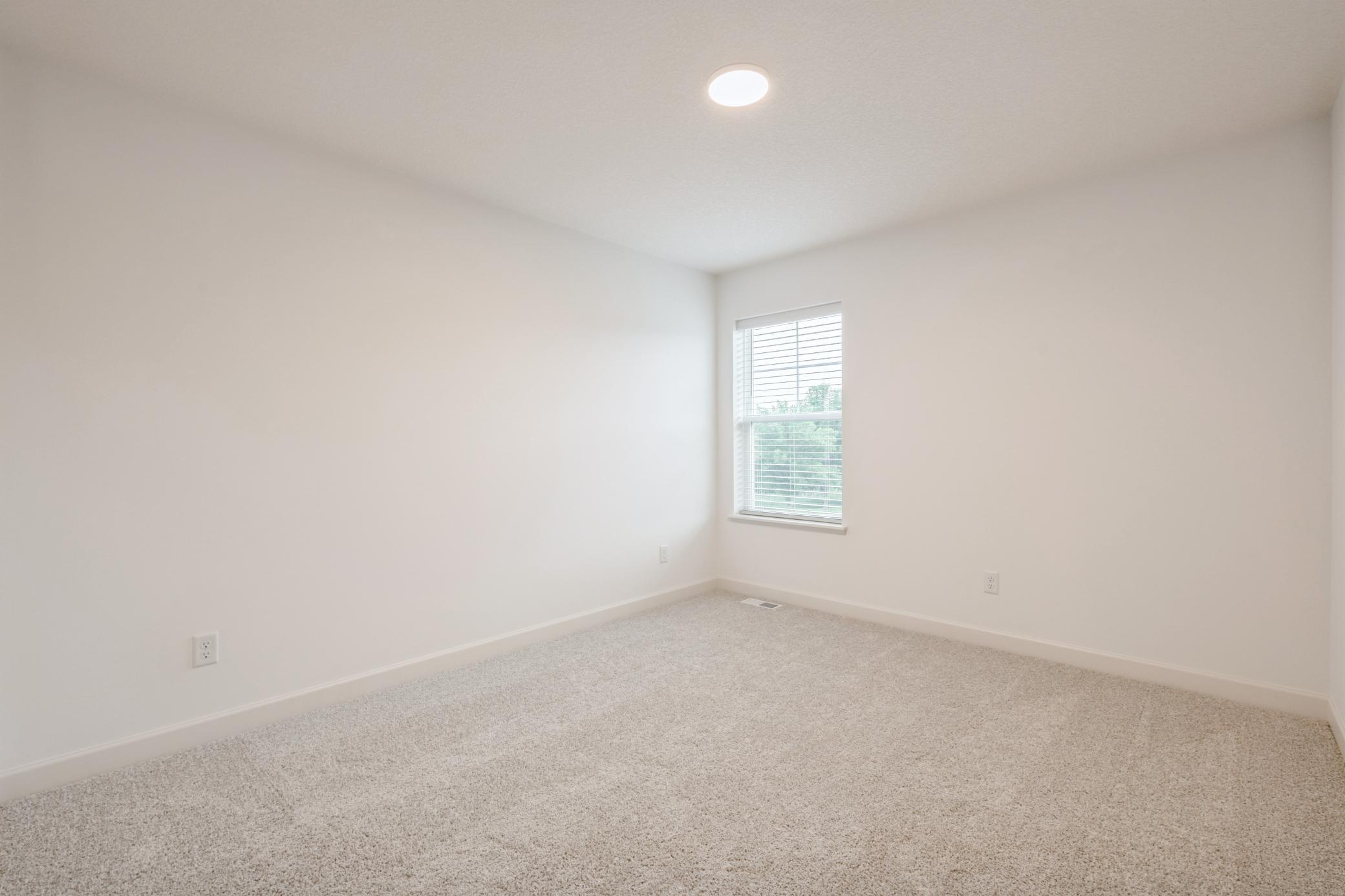 (Photo of a similar home, actual homes finishes will vary) Each of the home's secondary bedrooms come perfectly sized and all feature a spacious closet.