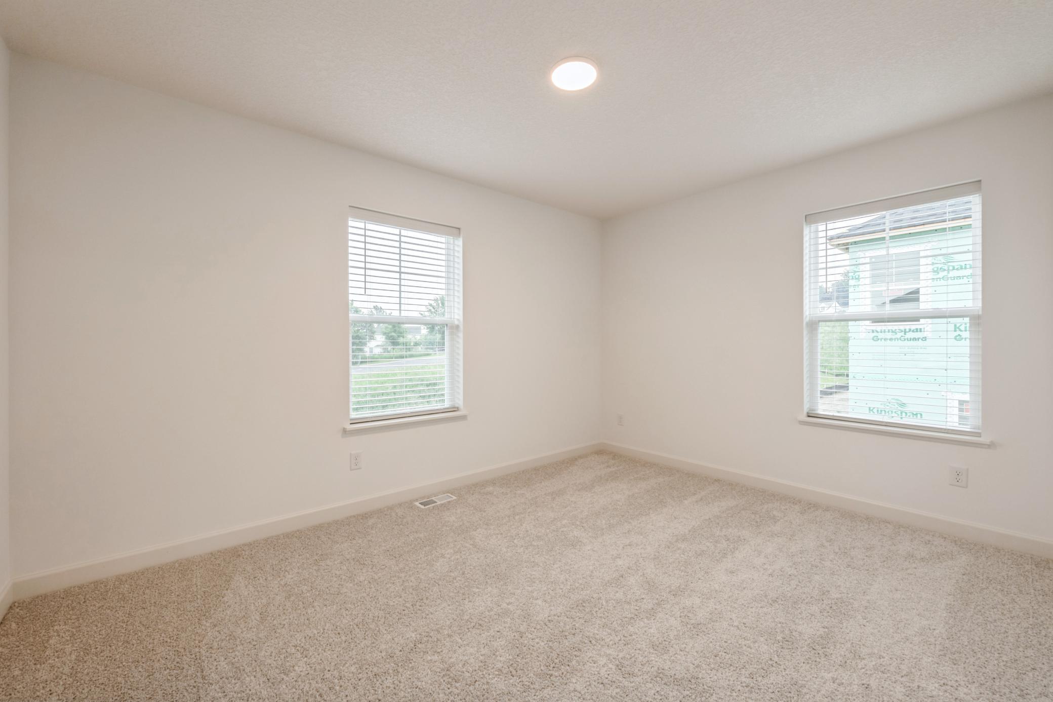 (Photo of a similar home, actual homes finishes will vary) Each of the home's secondary bedrooms come perfectly sized and all feature a spacious closet.