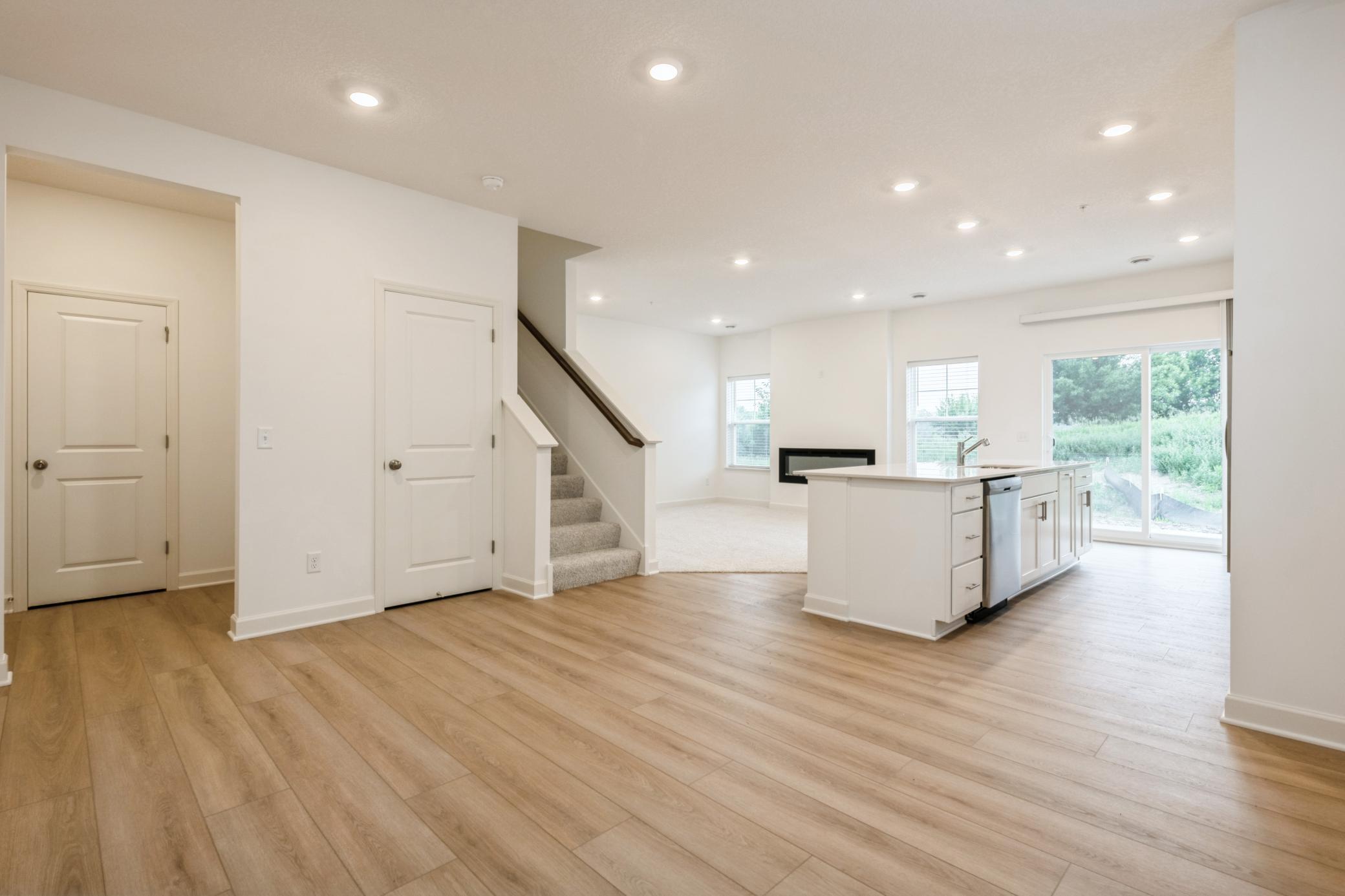 (Photo of a similar home, actual homes finishes will vary) Soaked in natural sunlight, the homes dining room has ample room for a dining table located in the heart of the home.