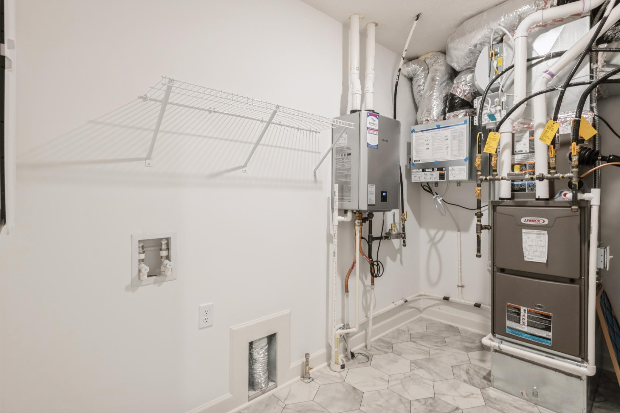 (Photo of a similar home, actual homes finishes will vary) Mechanical and laundry room.