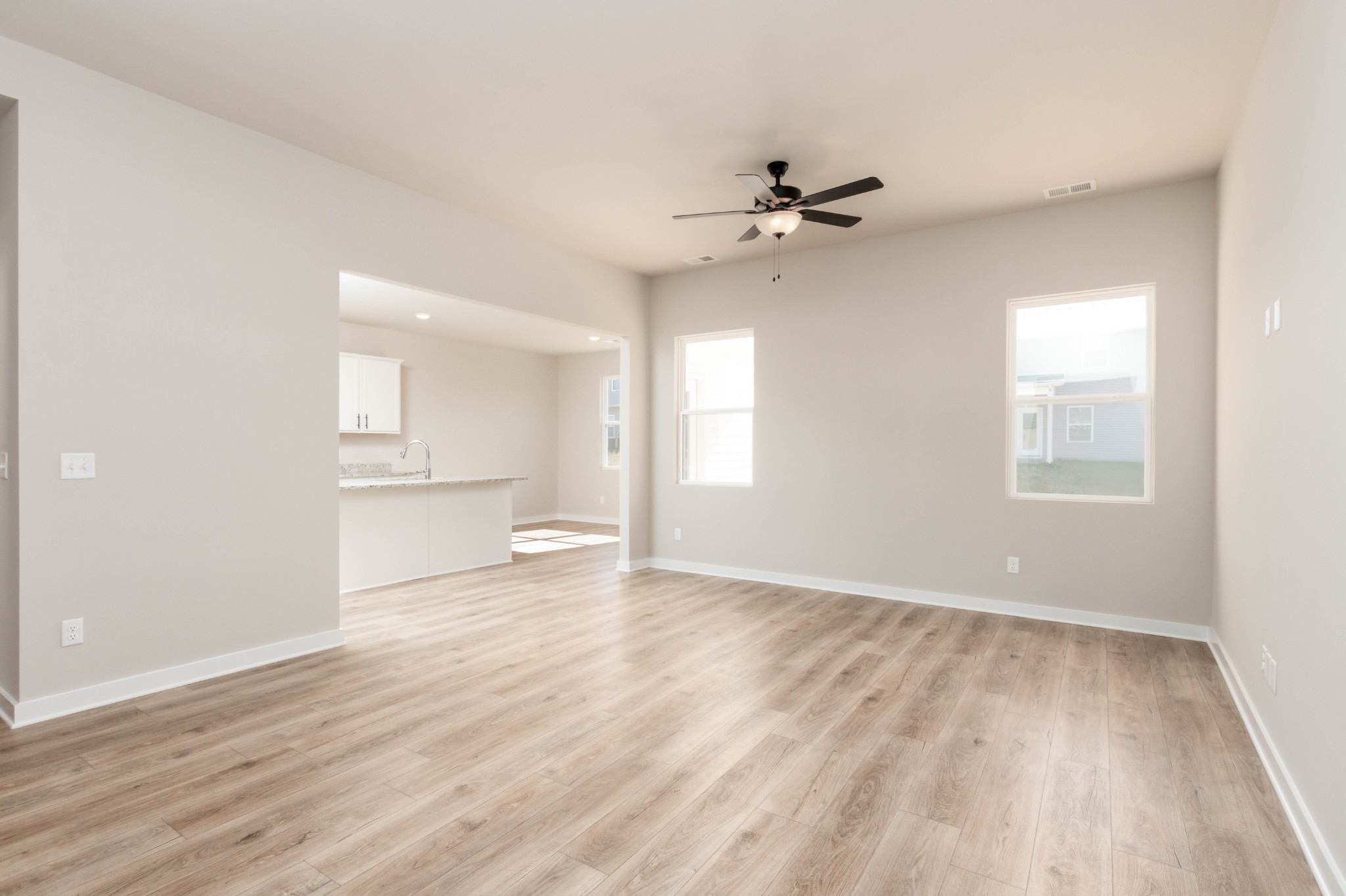 10-Ft Ceilings in this 19-ft x 14-Ft Living Room. Pictures are of a similar floorplan that was built previously. Representation ONLY. Buyer/Buyer's Agent to verify selections.