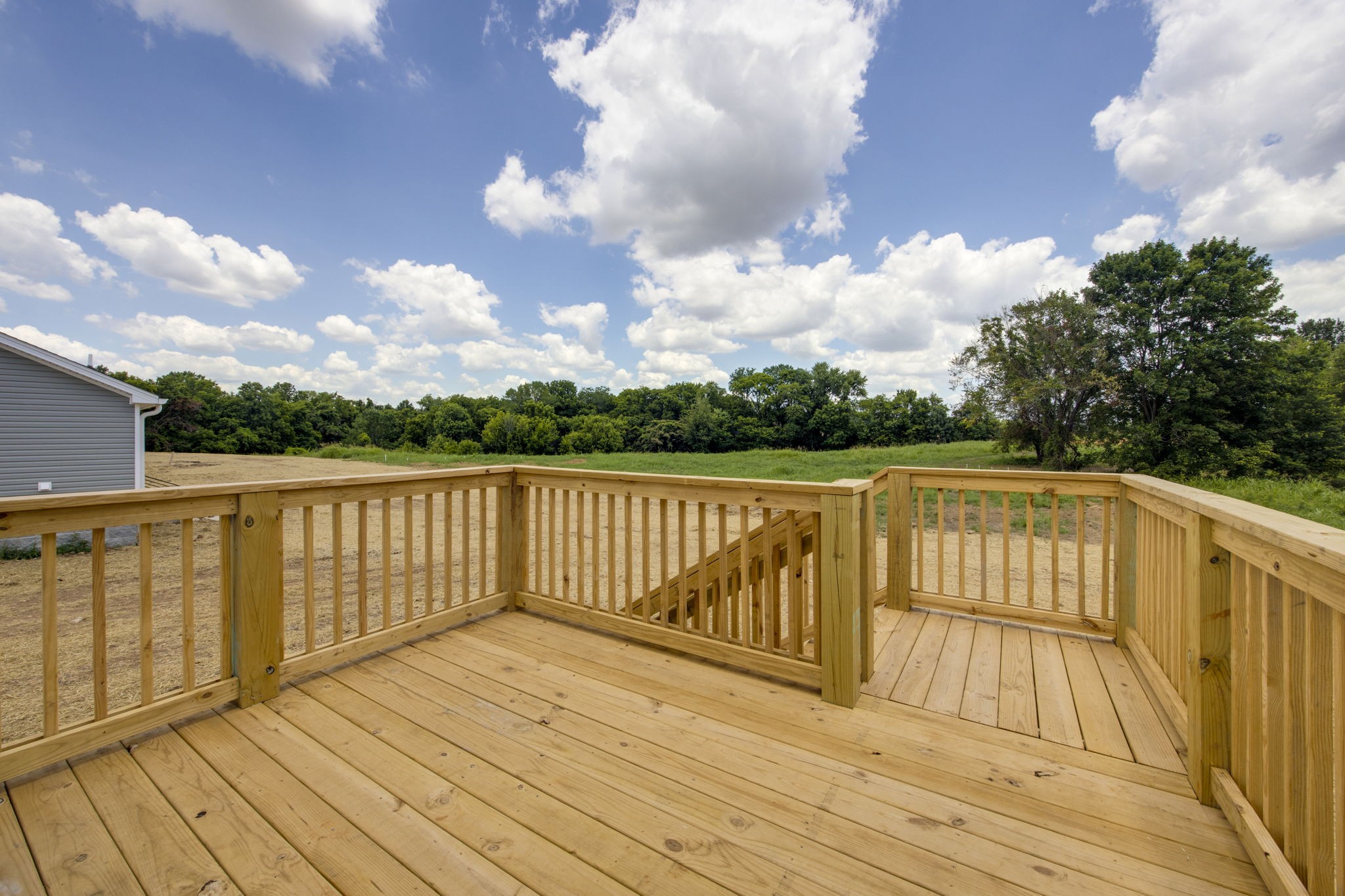 Look at this rear deck and the view it offers! Perfect for afternoon barbeques!