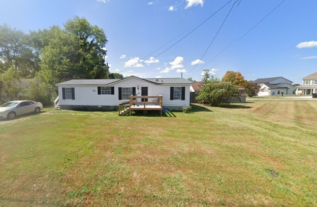 Manufactured home on a permanent foundation on Nunley Street side. 3-bed, 2-bath, 1,152 sf, 1993 built