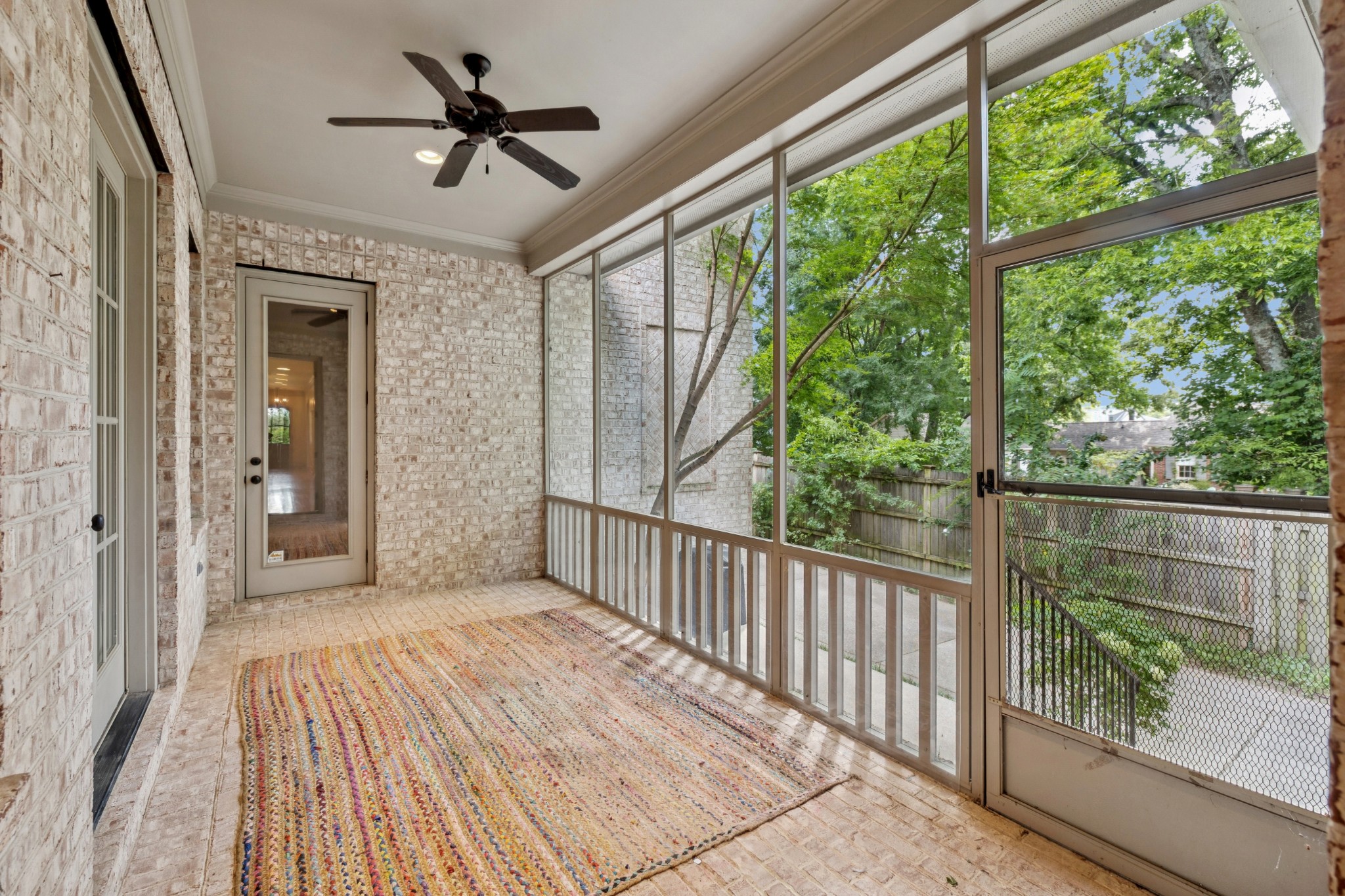 Screened area off the primary bedroom. Door leads to back hallway / stairs to area over the garage.