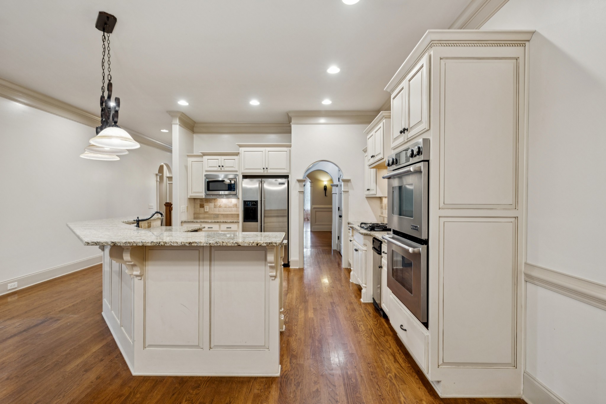 Double Ovens, trash compactor, microwave, refrigerator and gas cooktop