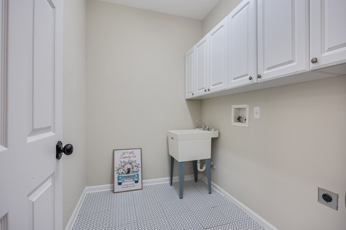 Nice laundry room tucked in the hall by the garage entrance. Would be a great drop zone.
