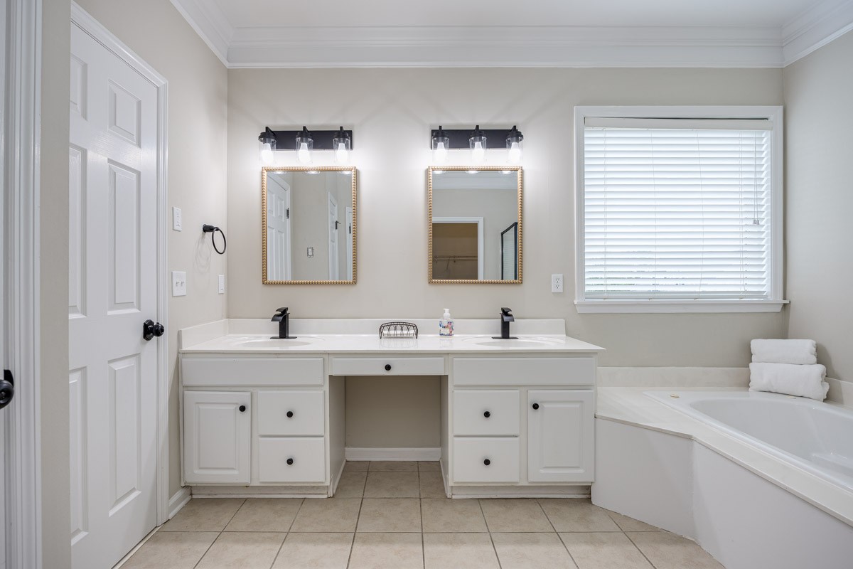 Huge primary bath with separate tub and shower. New lights and mirrors.