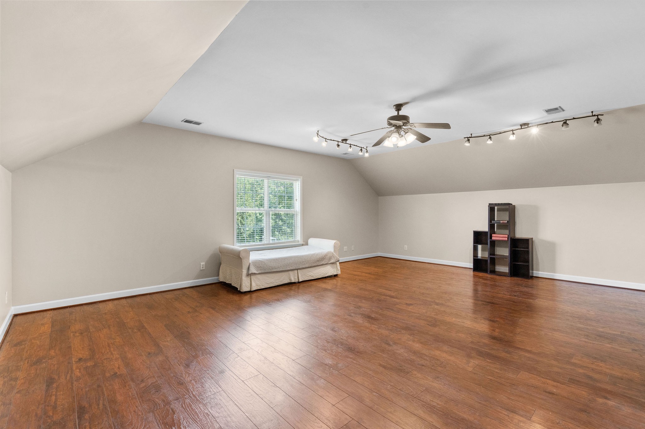 The upstairs bonus room can function as a fourth bedroom. It’s large enough to accommodate a bedroom with a separate living area set up. It is also ideal for a media or game room.