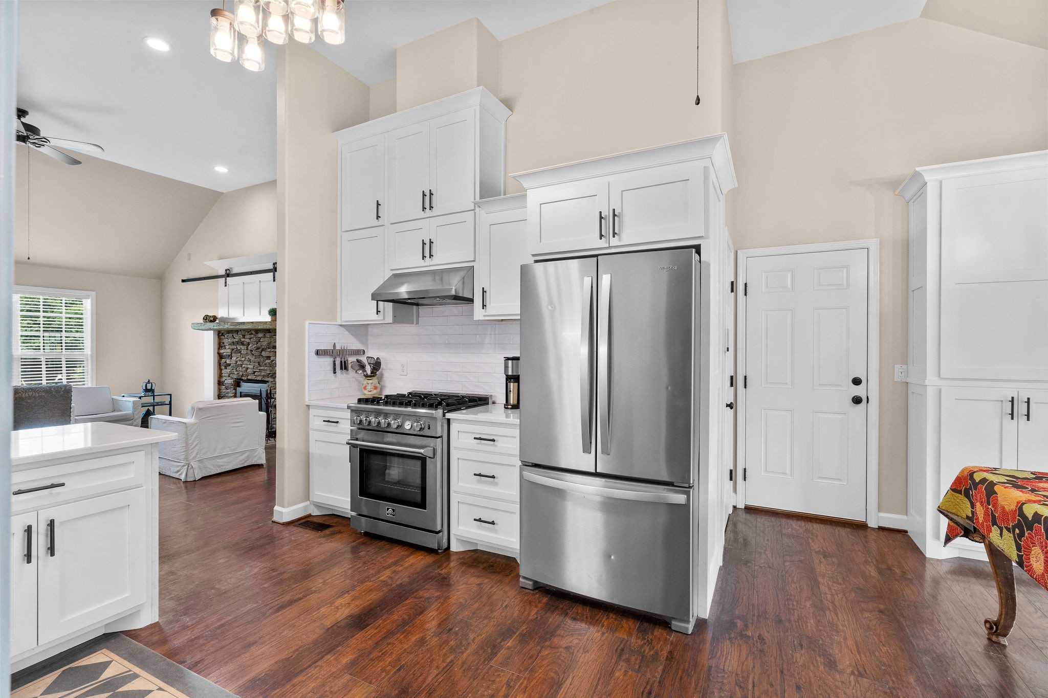 The 5-burner Forno gas stove makes cooking a dream! The door to the right is the garage entrance, to the left of that is the “petite pantry.“ Part of the larger second pantry can be seen to the right in this photo.