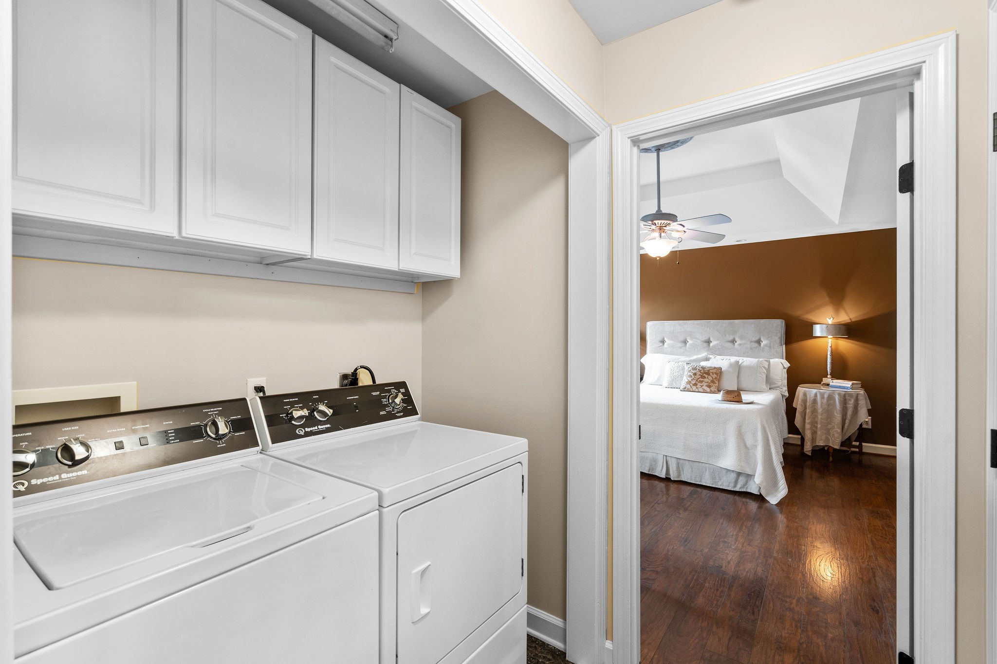 The laundry nook in the hall between the kitchen and primary bedroom is very convenient and makes life a little easier. A linen closet is located across from the laundry nook.