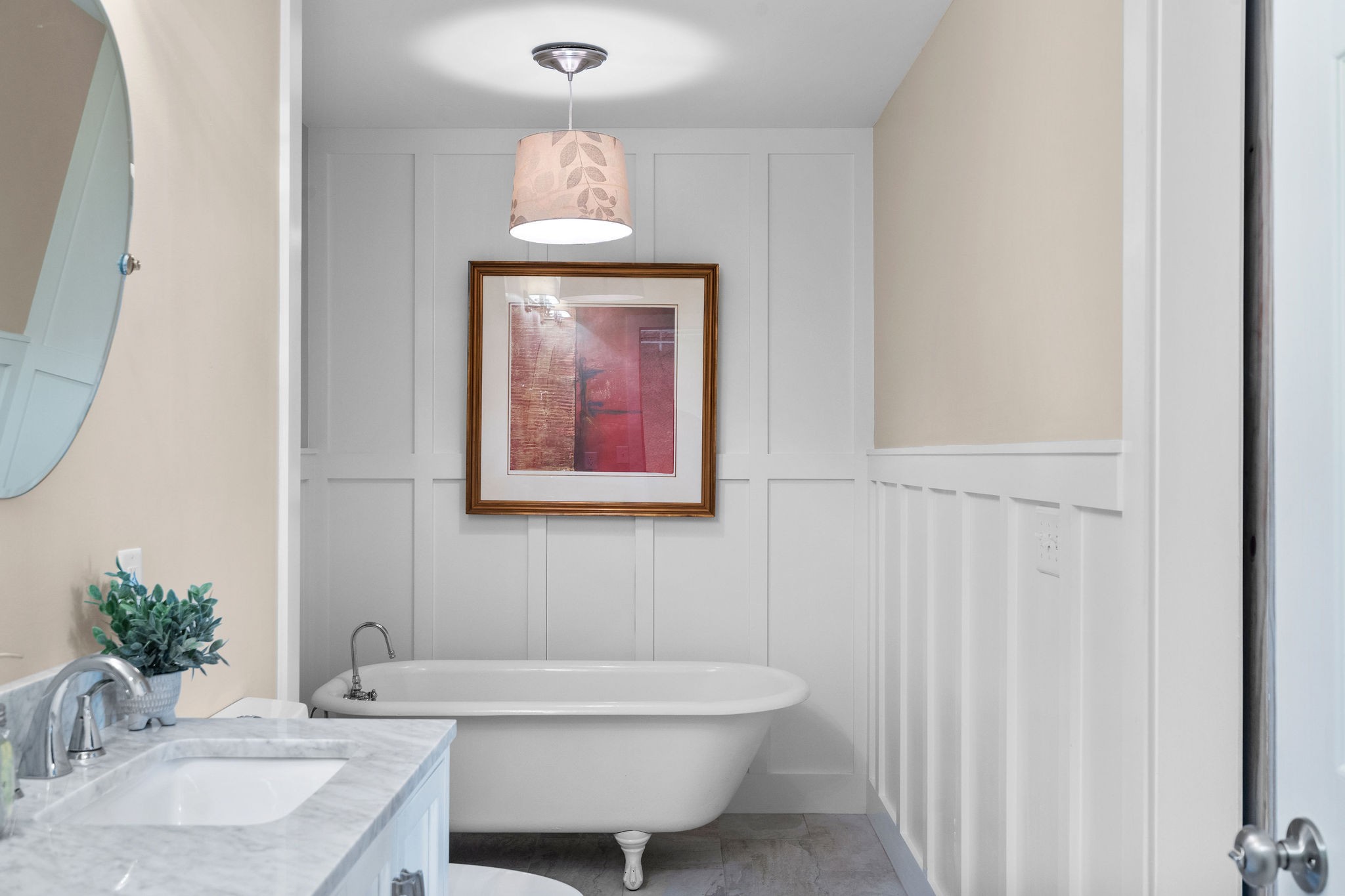 The custom board-and-batten wall treatment is a beautiful vintage farmhouse inspired touch.