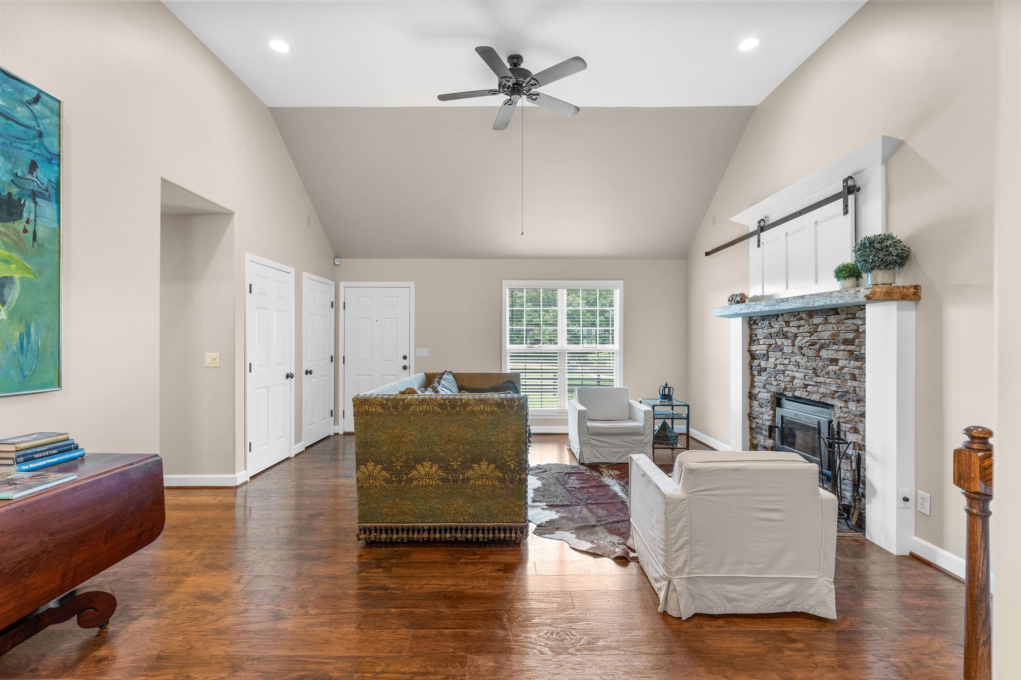 The box sofa in the living room is huge, but the room can still accommodate more seating, end tables and other furniture. The home interior has just been repainted for the new owners.