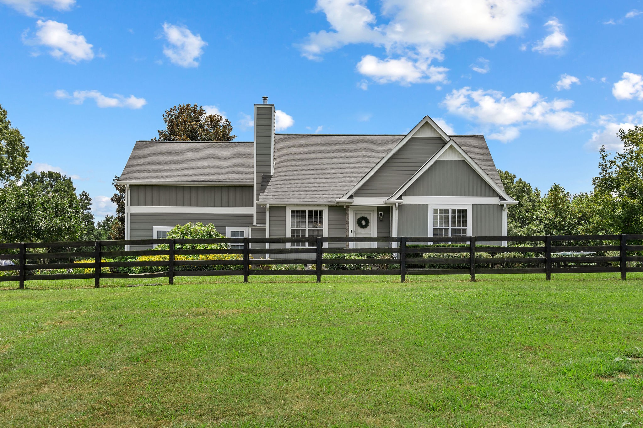The pasture in the front of the home is fenced, gated and separated from the home’s yard. Roof, siding and HVAC are all recent.