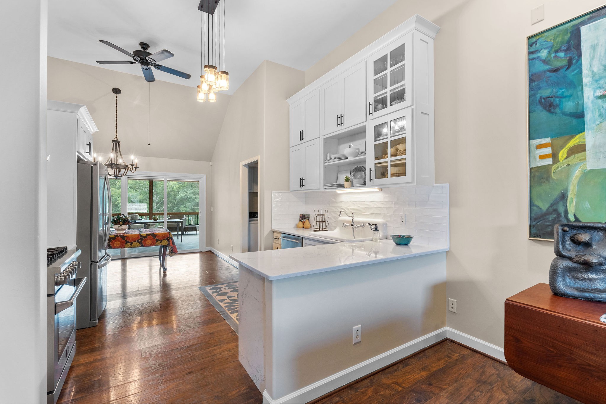 Custom Amish-made farmhouse cabinets and quartz countertops are notable features of this well design kitchen.