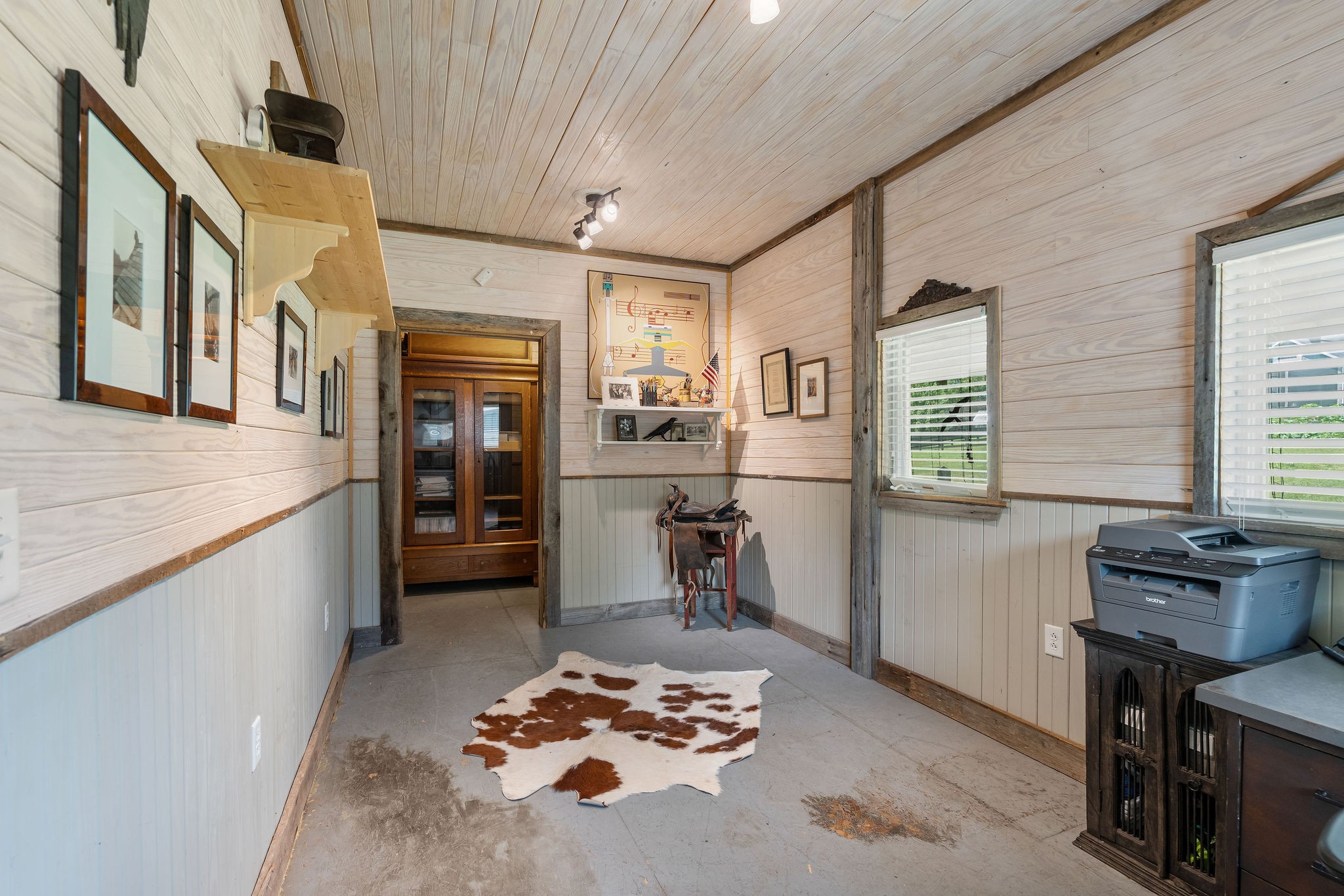 The barn tack room/office is a really nice space. The bead board ceiling and walls were made locally. The trim is antique barn wood.