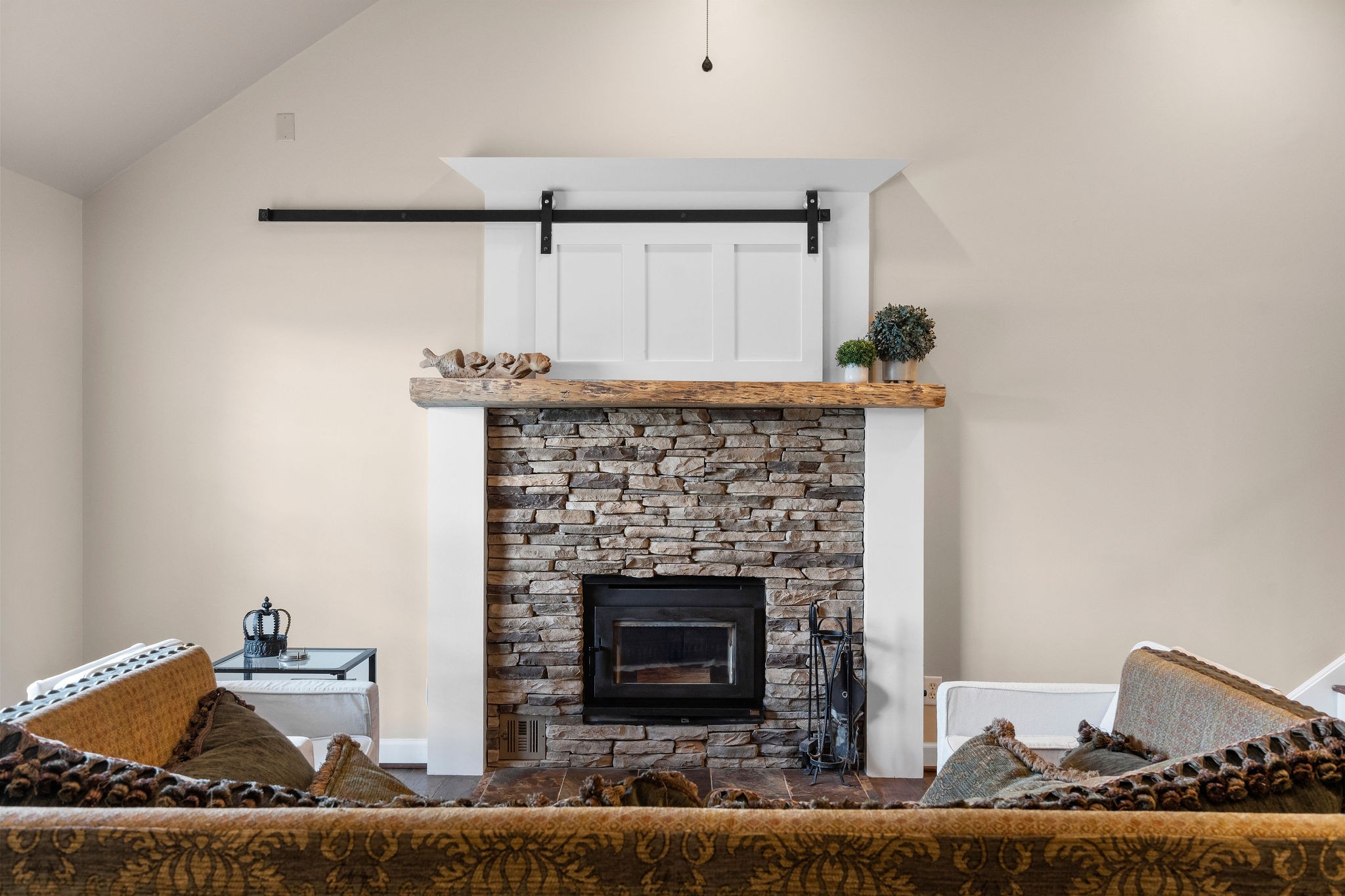 The current owners use this high-efficiency woodburning fireplace to heat the house throughout the winter, using the propane gas central heat as supplemental heat when needed.