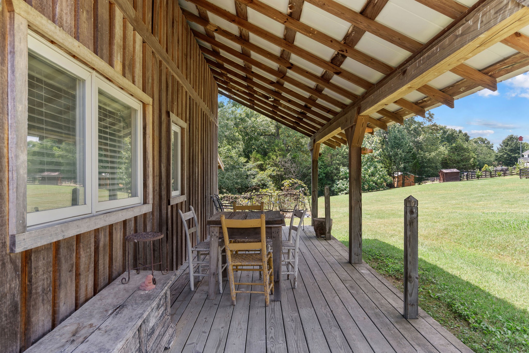The covered porch of the barn is another great place to hang out and enjoy a drink, good conversation and views of the property.