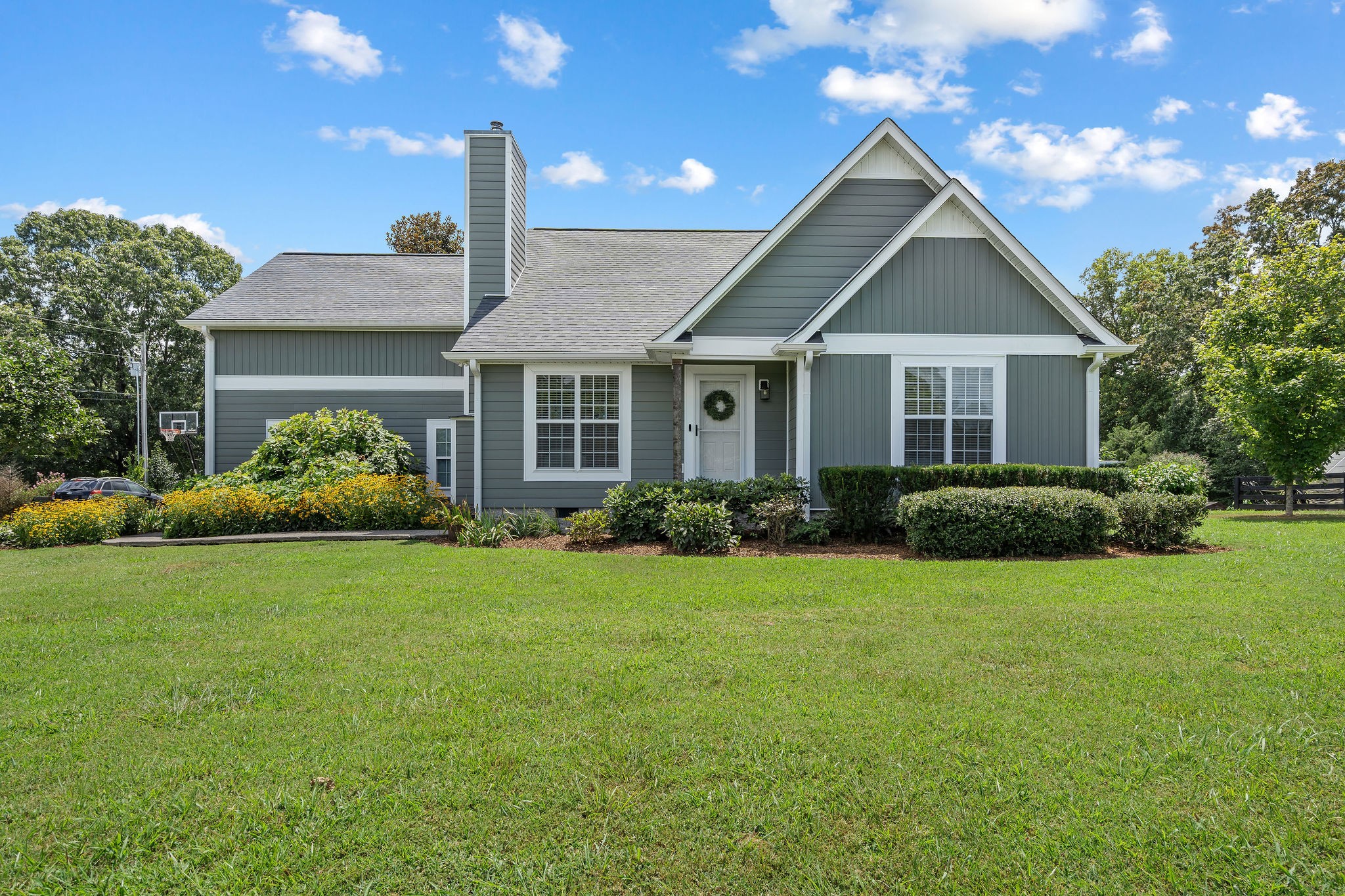 Mature landscaping and trees, fenced yard and pastures, barn with tack room/office, and a spring-fed creek in the woods to the rear of the property. Great country living with convenient access to shopping, dining and services.