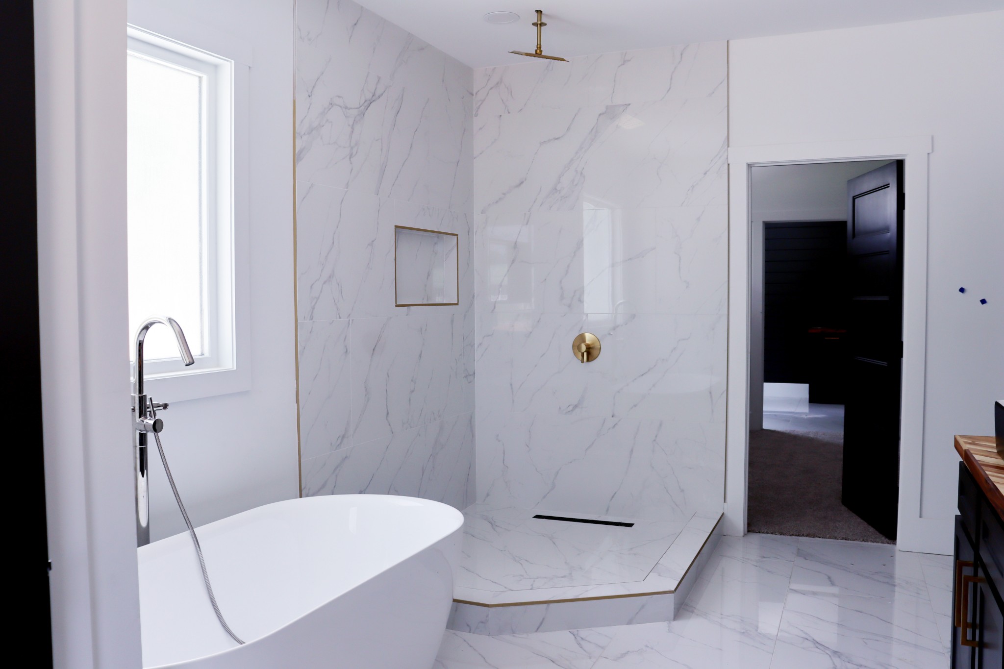 Unwind at the end of your day in your vessel soaking tub. The spacious shower is beautifully appointed.