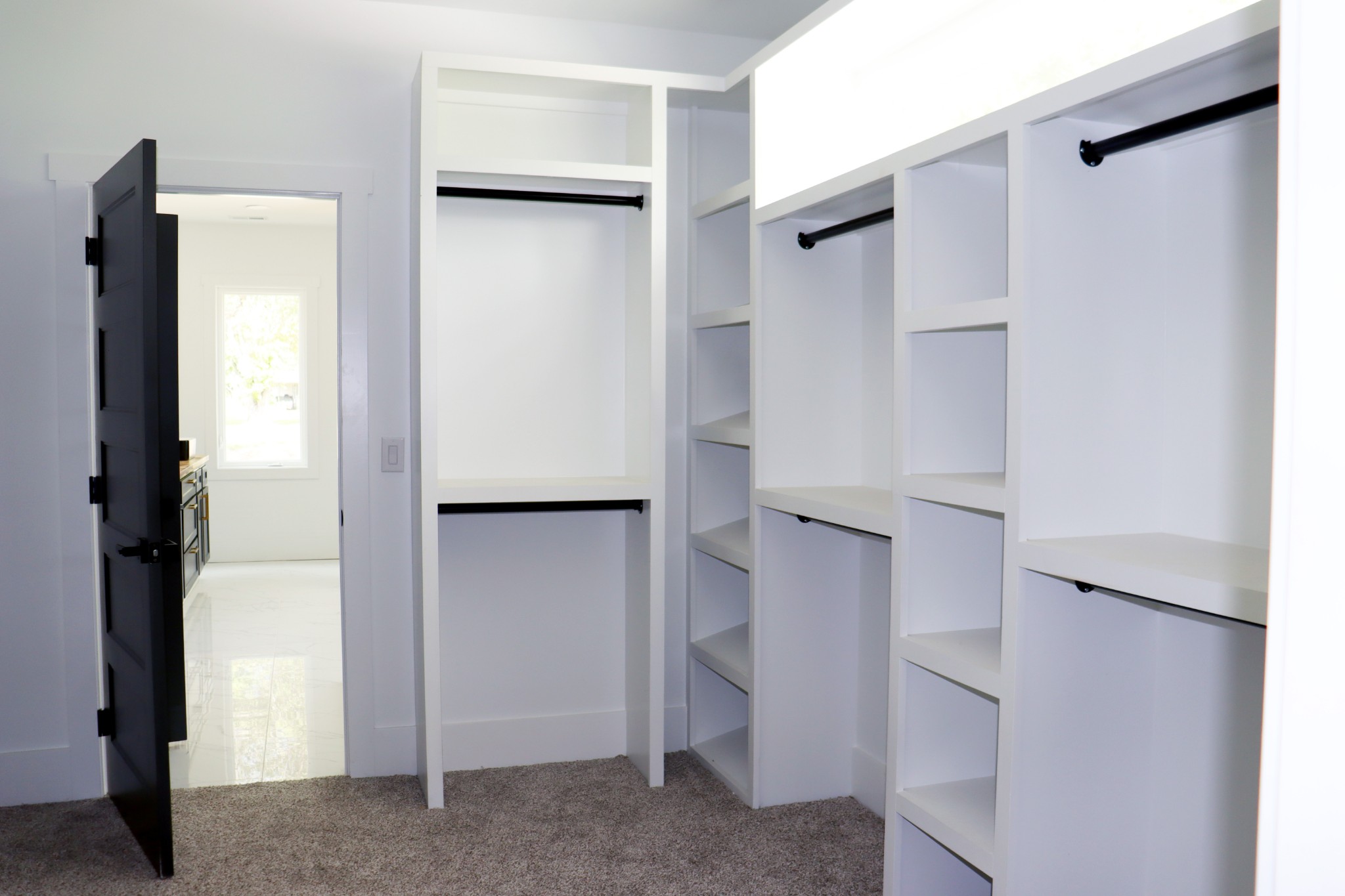 This picture shows the other side of the designer Primary closet.