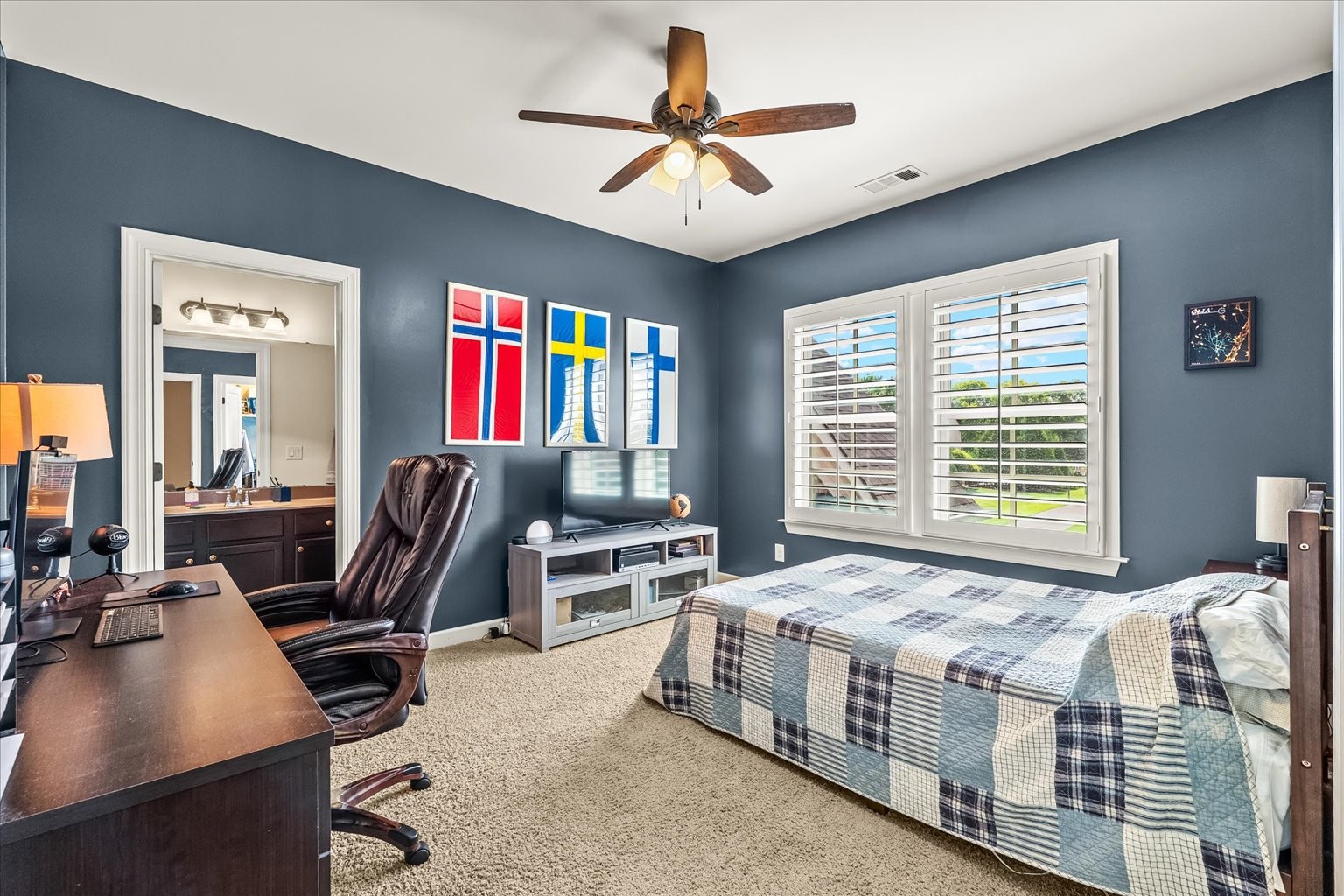 Bedroom 5 with it's own en suite and large closet, faces front of the house