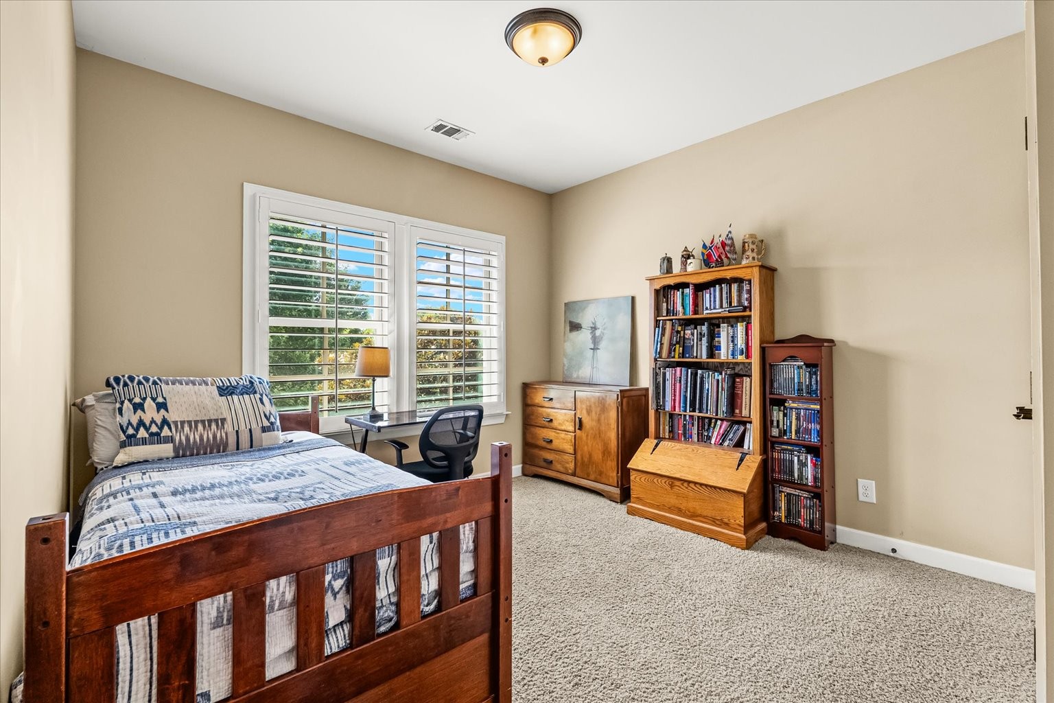 Bedroom 4, connects to same bath as bedroom 3, faces front of the home