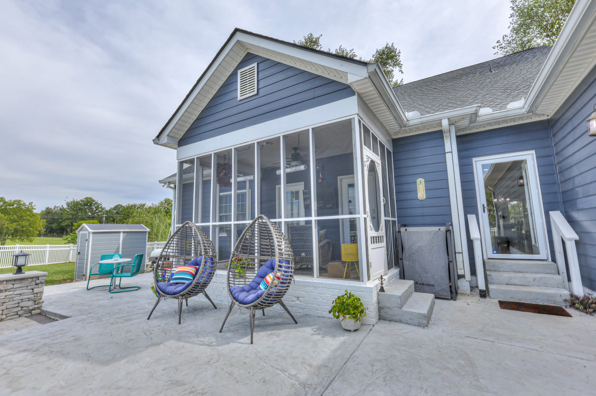 Screened in porch with doors leading to the master bedroom and to the family room. Also a tv for watching football on those fall afternoons.