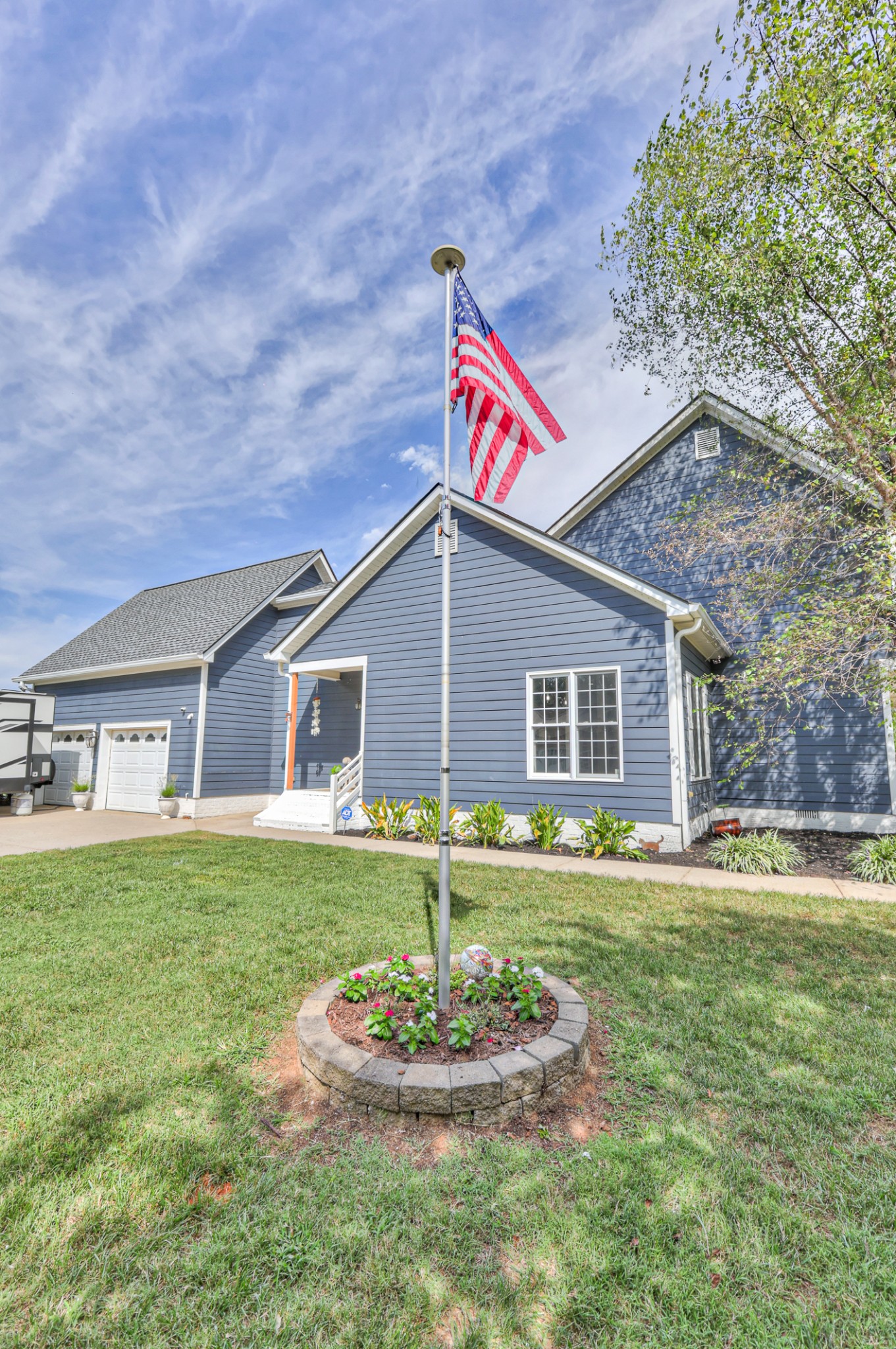 Telescoping flag pole with solar light kit on top