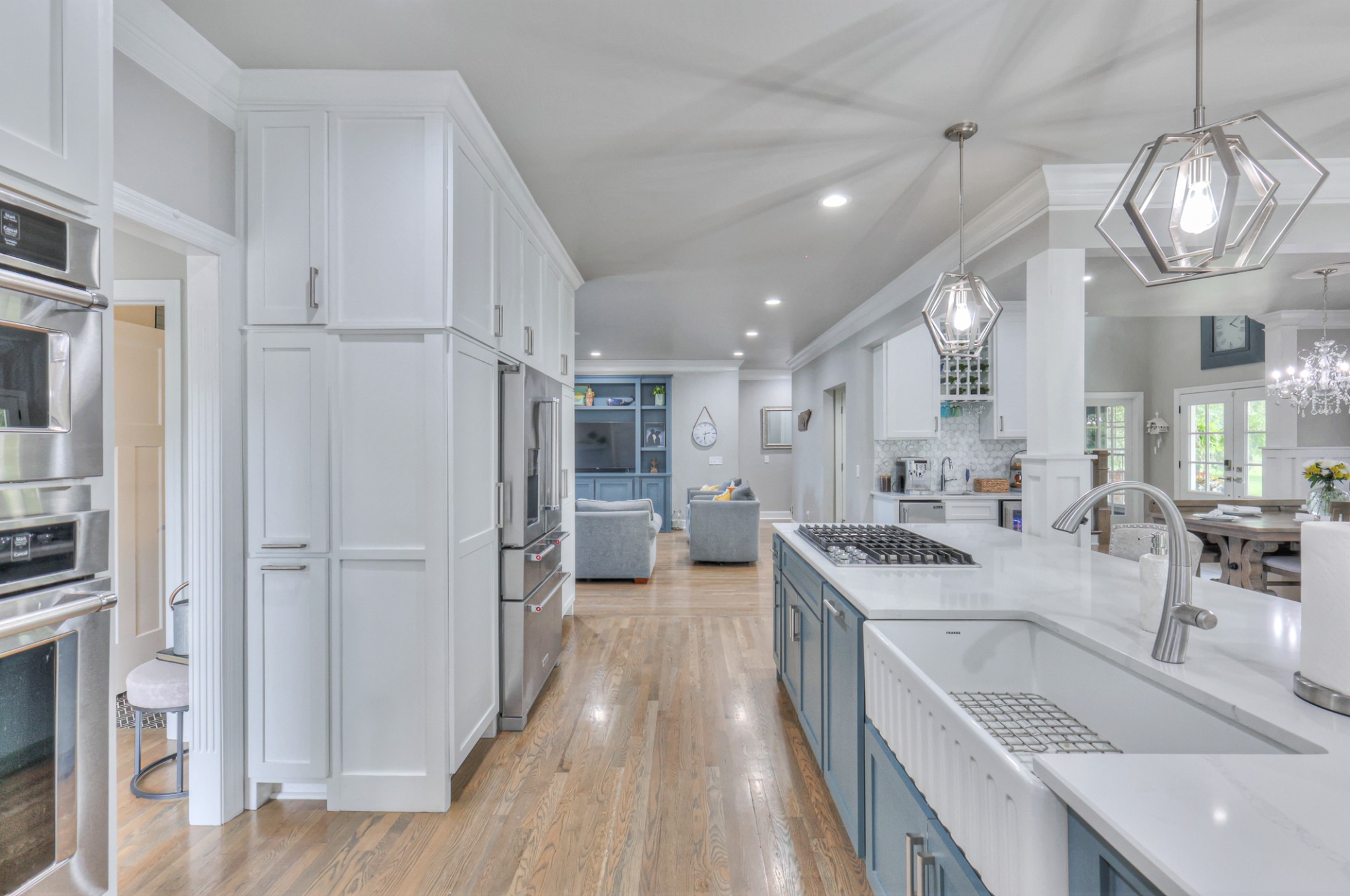 Farm sink with gas range top facing out so you can be part of the crowd