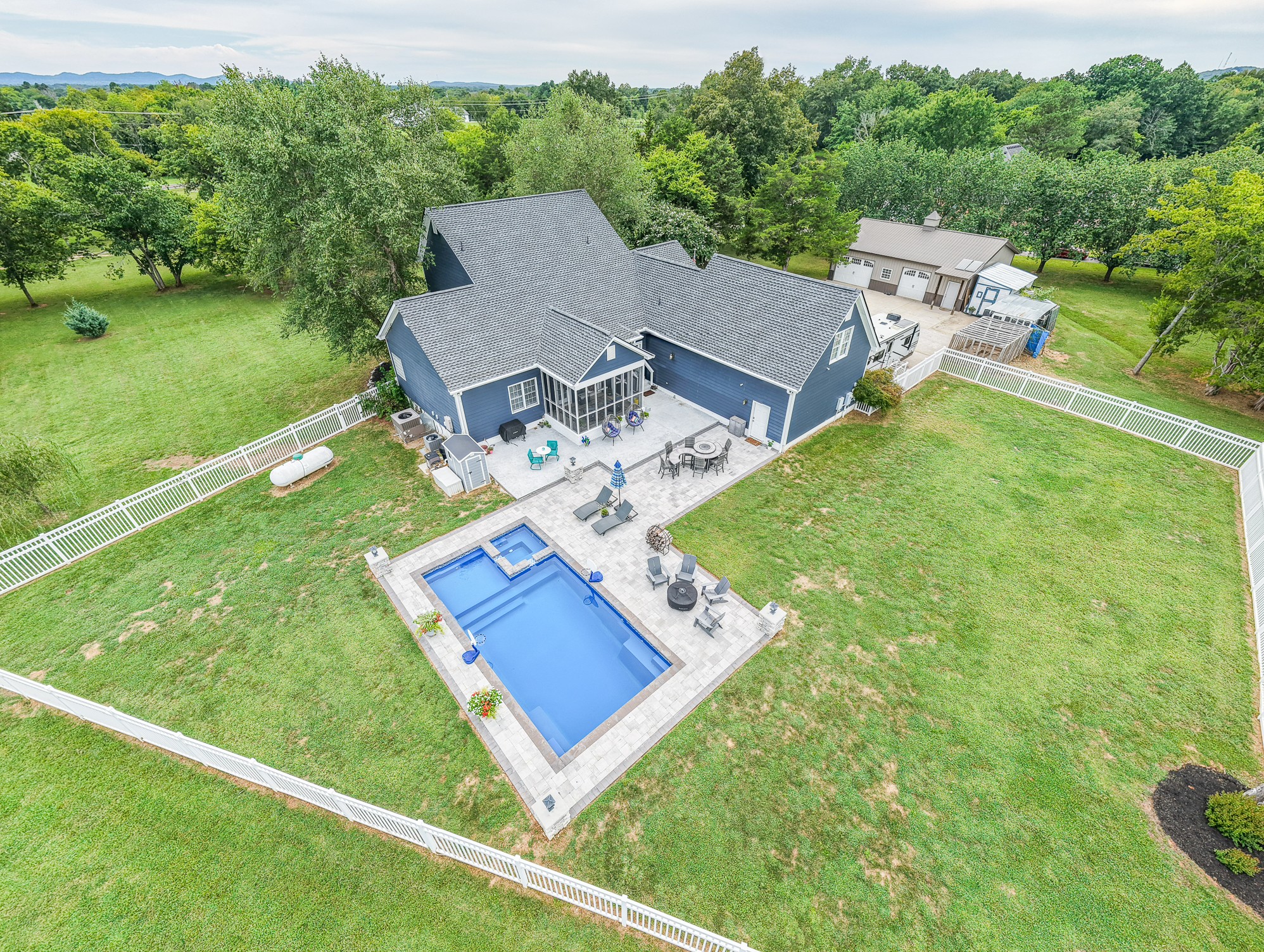 Fenced in back yard with gorgeous pool