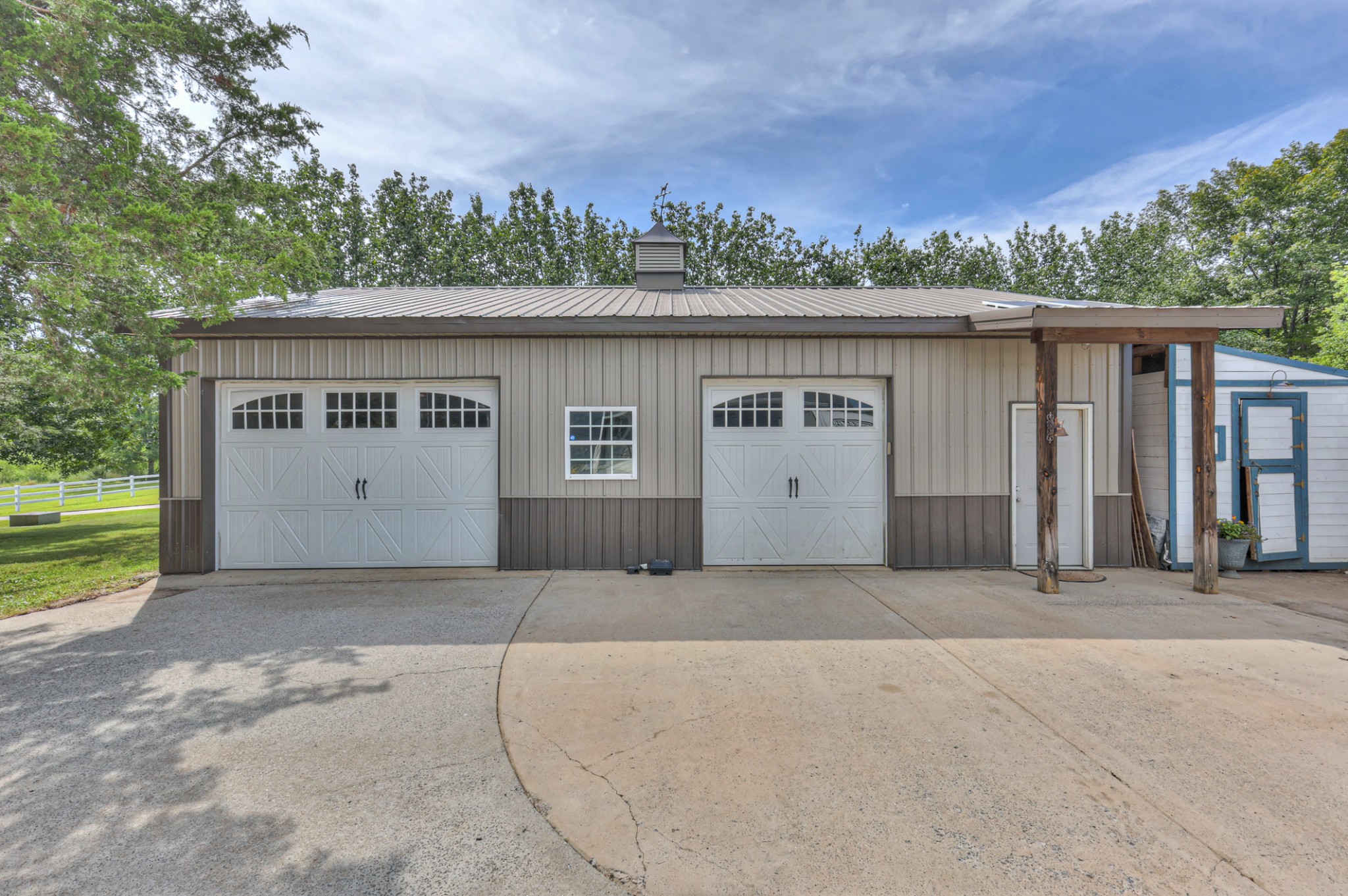 30' x 40' garage with 8' doors and shop. Bring your boat or your lifted truck. Entrance to chicken coop on the right
