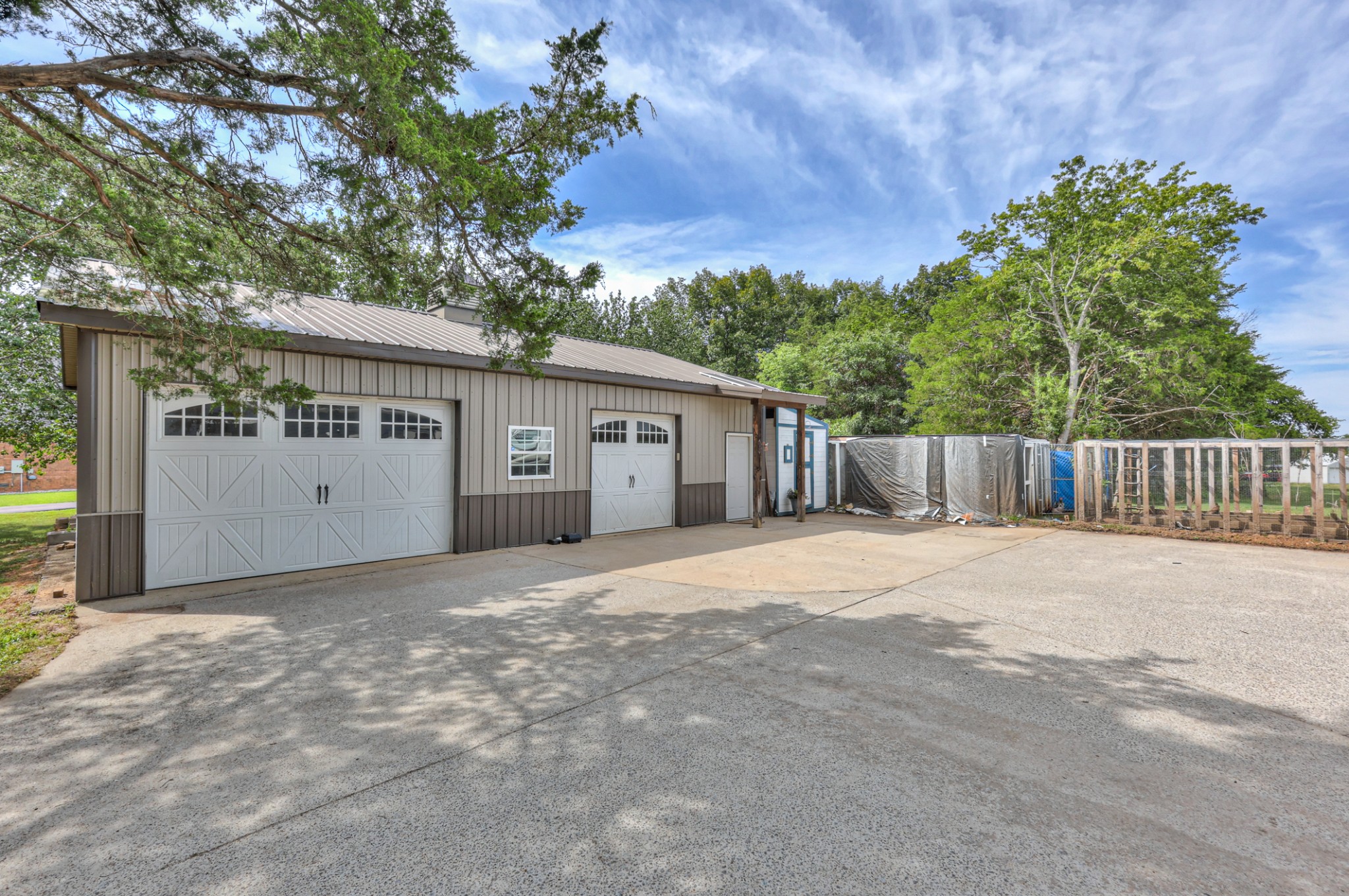 30' x 40' garage with 8' doors. Chicken coop and huge amount of parking for the pool parties