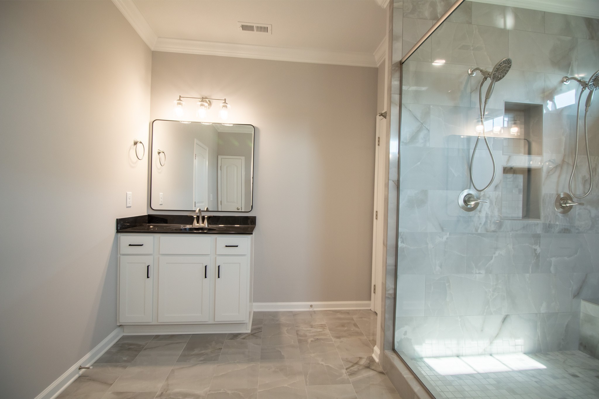 2 Separate Vanities and a Toilet Room!