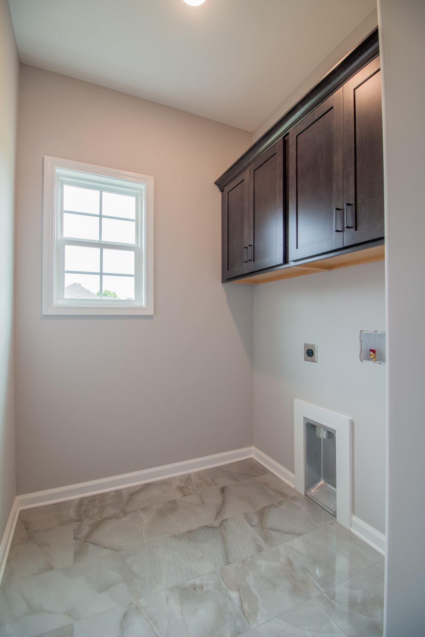 Spacious Laundry Room with Tile Flooring!