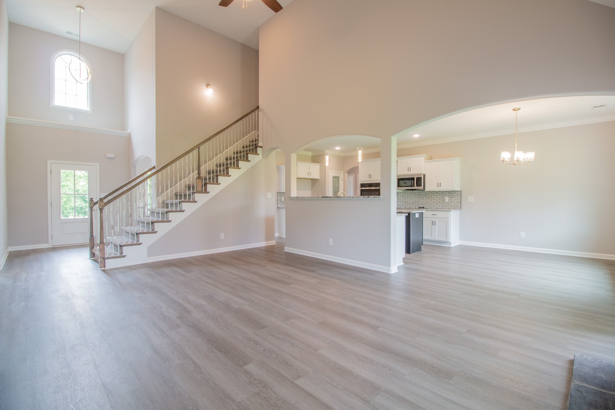 Open Layout Downstairs and SPC Flooring Throughout the Foyer, Living Room, Kitchen, Eat-In Area and Formal Dining Room!