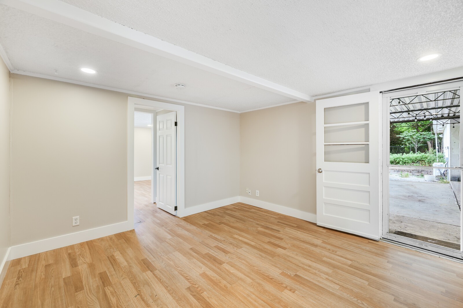 The flex space is in between the office/flex space and the kitchen--and leads out to the carport