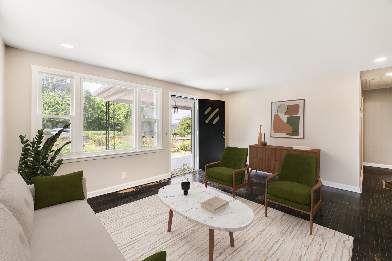 *virtually staged* The main living room as you enter the home has a wonderful view and natural light from the large front windows