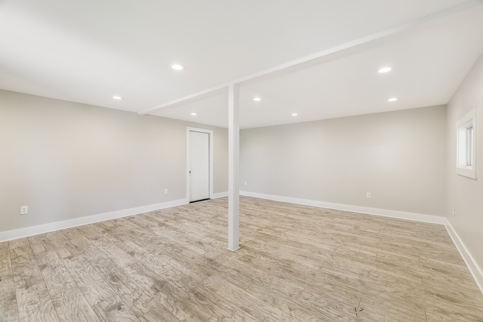 Enjoy recessed lighting. The door in back leads to an additional storage room