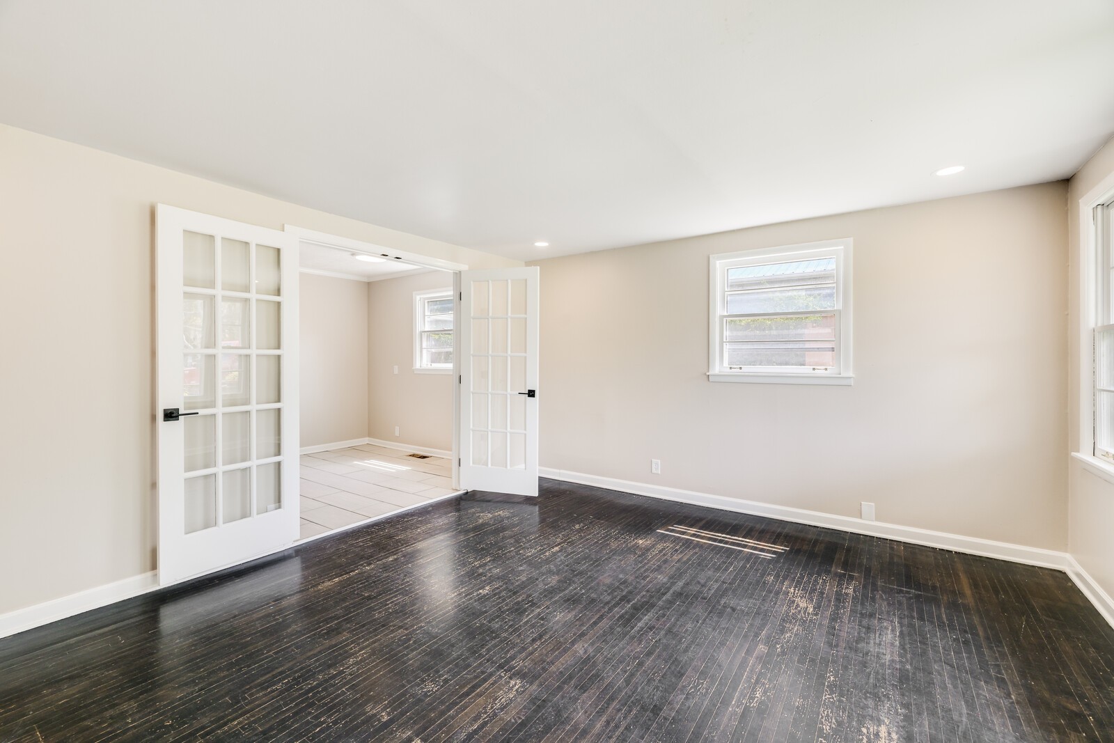 The French doors allow for separation/privacy from the kitchen if needed