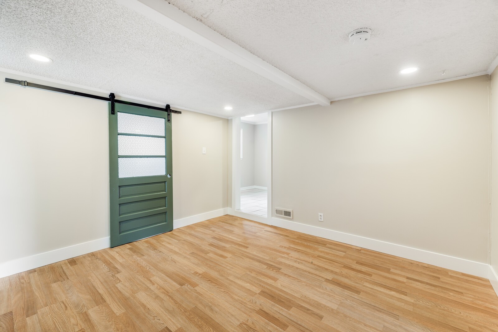 The sliding door in the flex space leads to the laundry room--this room is just off the kitchen and has an entrance from the 3rd bedroom
