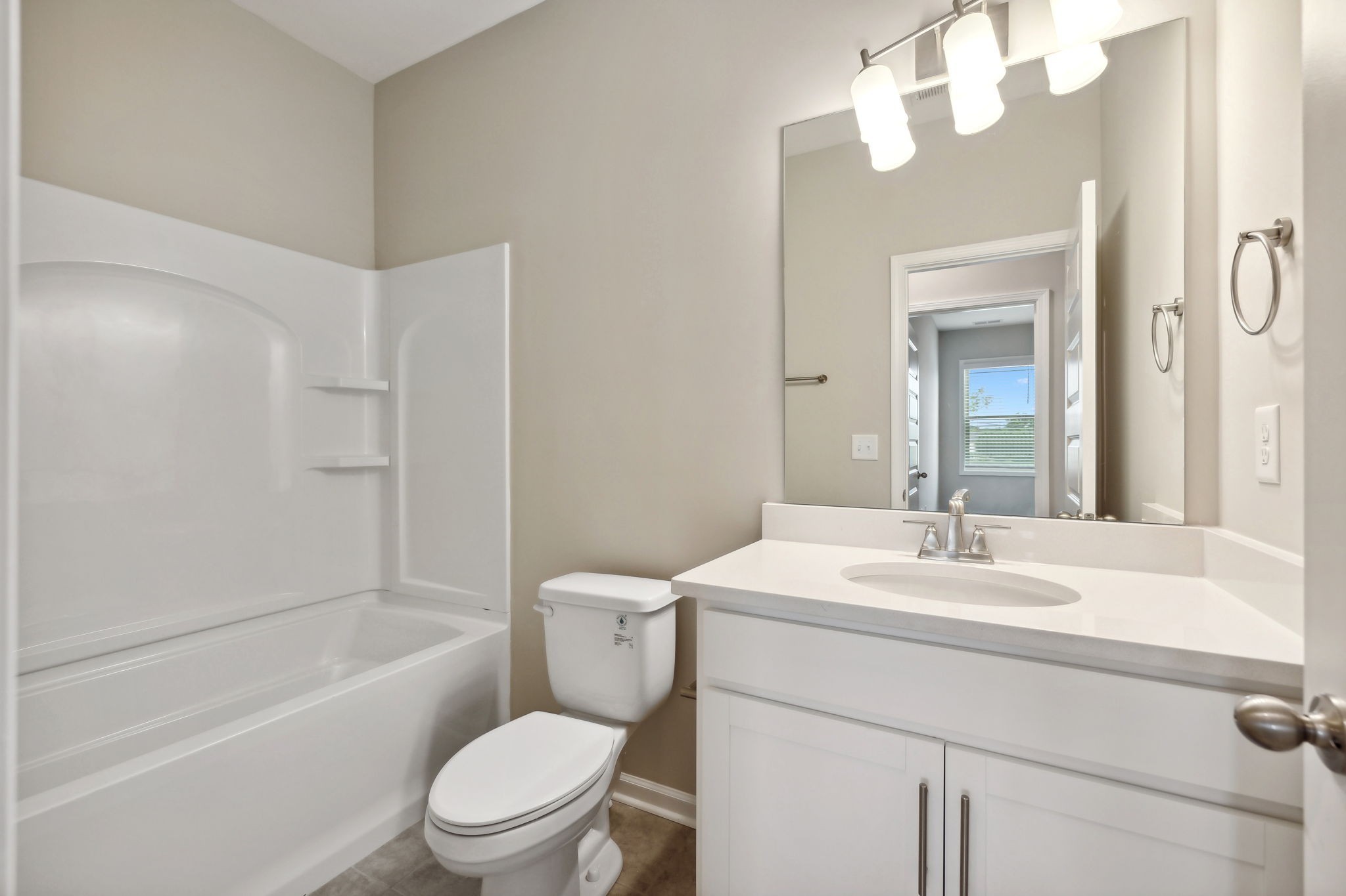 Secondary Bath equipped with Shower/Tub combo, Quarts Countertops, and is Conveniently Located across the Hall from Bedrooms 2 & 3.