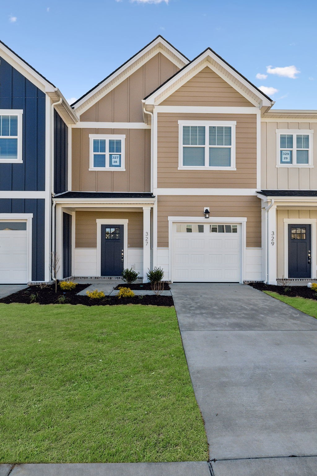 327 Carver Connection - our CLARA Floor Plan. Featuring beautiful Khaki Brown Hardie Body with White Trim.