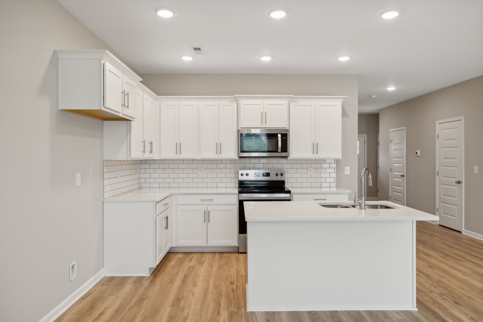 Premium Cabinets with Crown Molding, Quartz Countertops, and Subway Tile Backsplash!