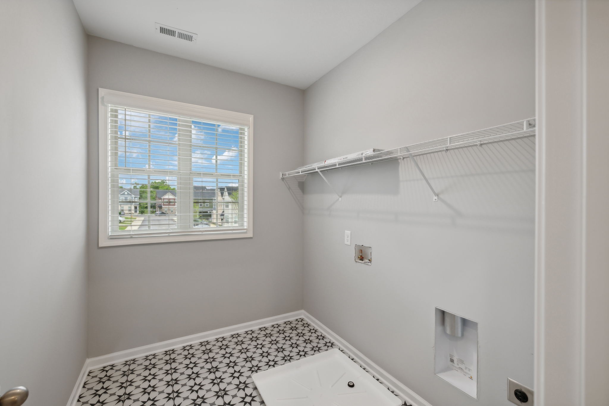 Beautiful Natural Light in Your Oversized Laundry Room with Ceramic Tile.