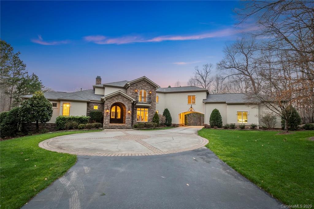 653 Ennis Road Waxhaw, North Carolina Impressive executive gated estate beautifully designed by Christopher Phelps and custom built by Simonini. A remarkably crafted home on 19 + acres. European ONE-OF-A-KIND masterpiece offers every desirable amenity. Sprawling open concept perfect for entertaining, intentionally designed to capture breathtaking views of the grounds and pond. Built-in pool with tanning ledge, waterfall feature and spa. Master Bedroom and luxurious Master Spa located on Main Level with terrace access. Kitchen is fully equipped with Thermador appliances, subzero refrigerator. Great Room has floor to ceiling windows, stunning stone fireplace flanked by custom built-ins. Basement has a separate full kitchen/bar area and living spaces. Perfect for multi-generational options. Amazing media room. Over-sized 3 car garage and future expansion with unfinished walk up attic. A separate guest house is ready for your renovation and finishing touches. Incredible place to call home. Just come see, come stay. Forever.