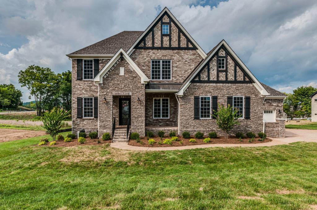 4600 Majestic Meadows Dr. #841 Arrington, Tennessee French Tudor Exterior! Same Layout as Kings Chapel Model! TWO Bedroom Suites On Main! 10'Ceilings w/8' Doors. 9' on Second Floor! Vaulted Family Room w/Cedar Beams w/Wall of Windows! HUGE Mud Room w/DOG WASH! HOW COOL!? Covered Rear Porch+Outdoor Fireplace & Patio! Glamorous Owners Retreat w/ DRIVE THRU SHOWER+Free Standing Tub! Wood Shelving & Estate Crown Throughout+ Sand & Finish Hardwood! SO MANY BELLS, JUST BRING THE WHISTLES!