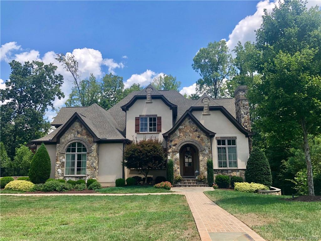 6045 Kimbrell Heights Drive Indian Land, South Carolina Staying home has never looked better! You will never want to leave this home if you are sitting in your own backyard paradise on a gorgeous stone & travertine patio enjoying the spectacular 18x34 heated salt water pool & spa, outdoor kitchen & fire pit! This stunning, custom built, European style home is located in the gated community of Longbrooke, just minutes south of Ballantyne. Beautifully appointed w/ luxury custom finishes throughout, this home has master on main w/ spa-like bath, covered balcony & terrace, gourmet kitchen, drop zone, butler’s pantry, formal dining, 3 fireplaces, foyer w/ reclaimed wood accent wall. Upstairs has 4 bdrms plus bonus. Incredible finished basement perfect for entertaining w/ kitchen area, huge great room, exercise room & bedroom suite, abundant storage space. Oversize garage w/ new epoxy floor & custom built-in storage. Move-in ready w/ refinished hardwoods, fresh paint & new carpet upstairs.