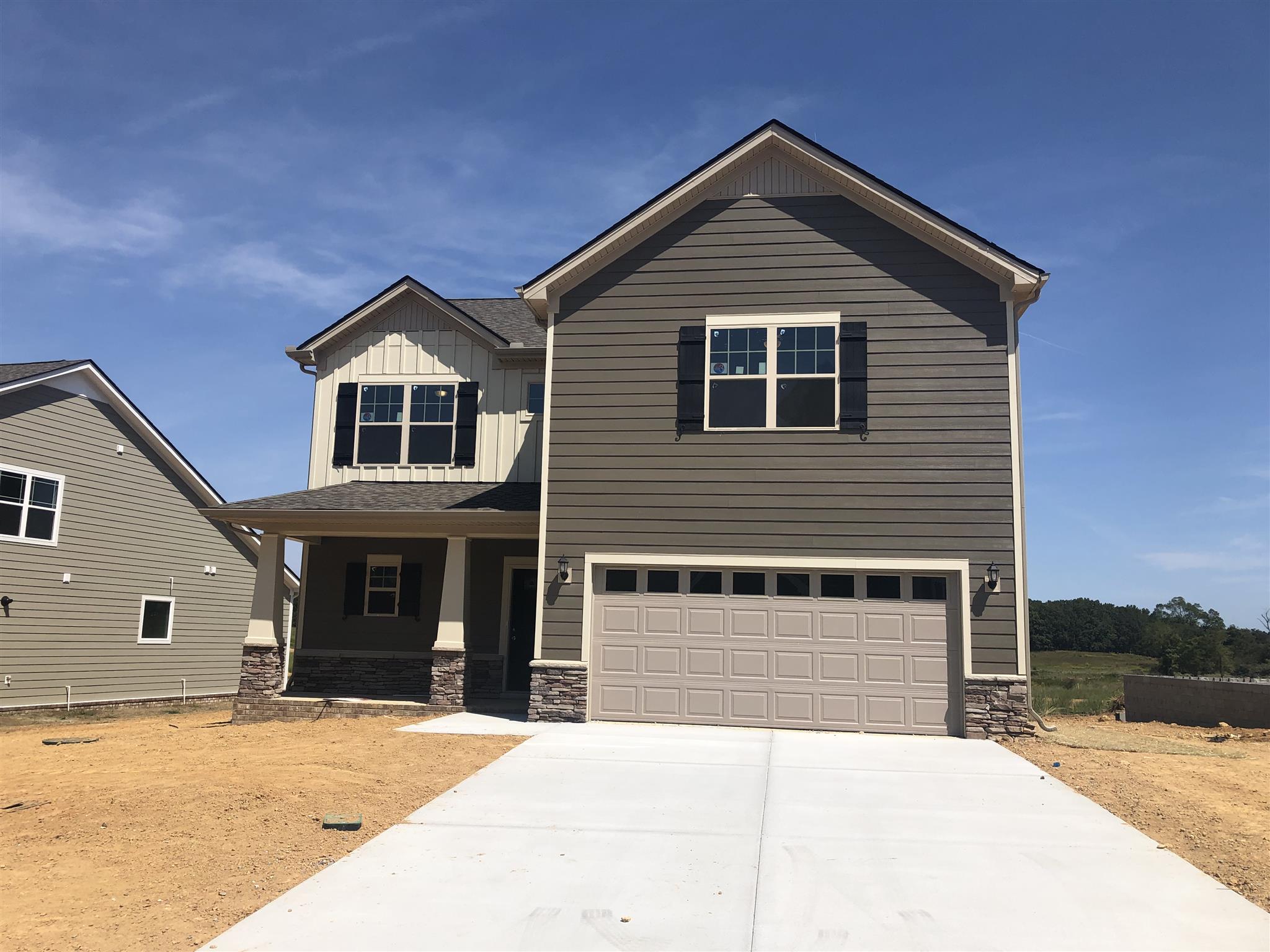 1045 Brayden Drive Lot 53 Fairview, Tennessee Four bedrooms with bonus room and formal dining room. Covered rear porch, all laminate flooring on main level, all kitchen appliances in stainless steel. Most photos are file photos of completed 2540 plan.