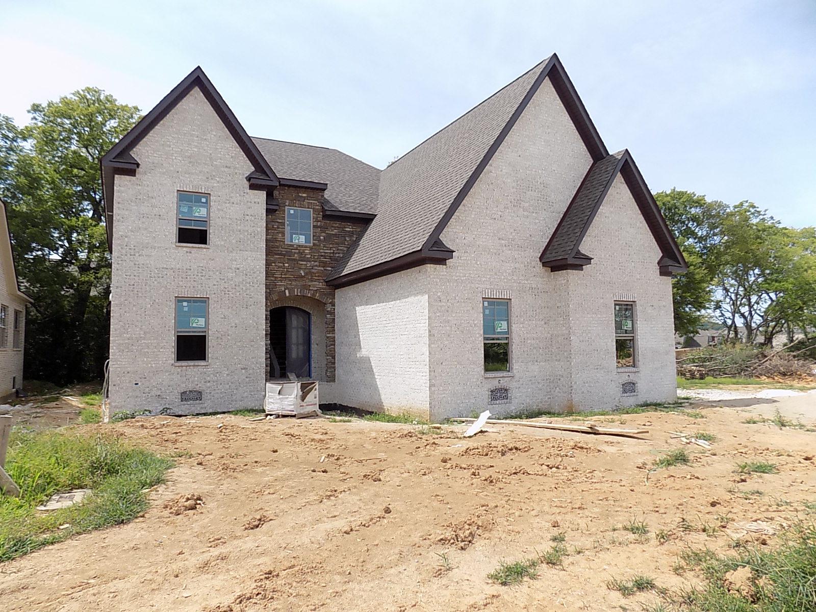1573 Bunbury Dr (255) Thompsons Station, Tennessee Lot backs to mature tree line; 5 BR/4 Full Ba/ 2 half Baths/ All Brick Home by Clark Custom Homes; Open Floor Plan; 2 Story Foyer; Master BR & Guest or Office down; 10' Ceilings on main and/or Vaulted ceilings; Large eat-in Kitchen w/ Bar Seating at Island; Sand/Finish Hardwood on main; Large secondary BR's up w/ WIC's; Bonus Room w/ wet bar and half bath; Covered porch w/ FP