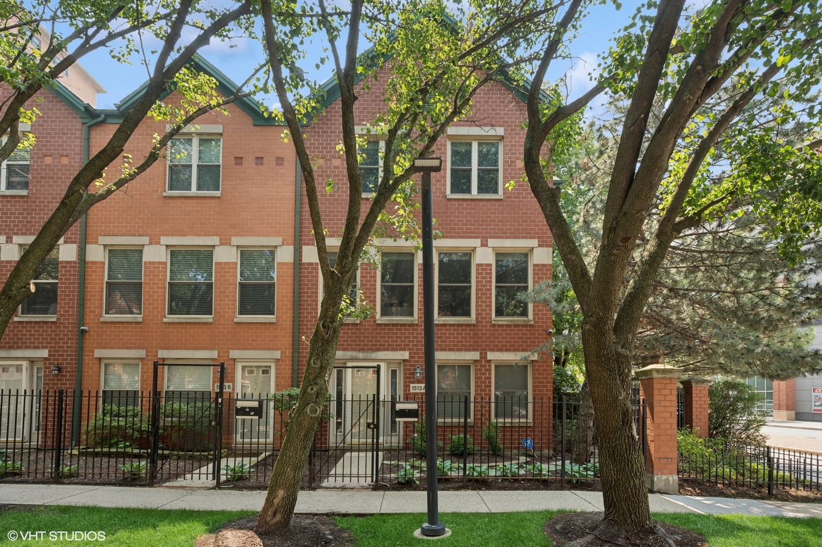Location! Urban oasis living in this extra-wide, end-unit townhome located in a gated community just steps from the best of Old Town and Lincoln Park. This spacious 3BR + Den, 2.5BA home lives like a single-family with North, South, and West exposures, including a sun-filled kitchen with southern light. Features include hardwood floors, crown molding, recessed lighting, and a large, welcoming entry with porcelain tile. The open-concept kitchen offers stainless steel appliances, granite countertops, an island with a beverage fridge and seating, and opens to a sunny balcony overlooking a garden patio. The living room features a cozy gas fireplace, and the first-floor family room offers additional gathering space. The luxurious primary suite includes vaulted ceilings, a spa shower, heated floors, and a double vanity. Two additional bedrooms share an updated hall bath with marble counters, tile, and heated floors. The laundry room features a new LG side-by-side washer/dryer, built-in drying rack, and sink. Updates throughout include a new furnace, water heater, dishwasher, stair railings, and more. Additional highlights: Elfa closet systems, a newly installed pull-down attic ladder with storage shelving, and an attached 1-car garage plus parking pad. Community amenities include guest parking, a playlot, and basketball court. Ideally located near Mariano's, NewCity, Whole Foods, public transit, and top-rated schools. Land lease is included in the monthly assessment.